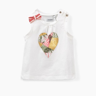 IKKS sleeveless blouse in white color with heart print.