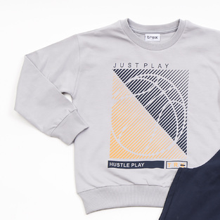 Seasonal TRAX tracksuit set in gray with "JUST PLAY" logo.