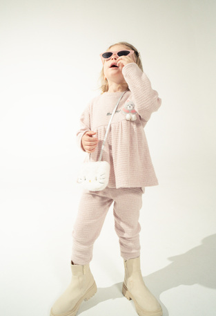 EBITA knitted pants set in pink color with a fur bag.