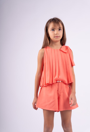 EBITA shorts set in peach color with pleated fabric.