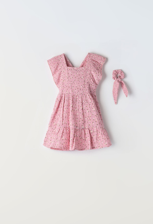 EBITA dress in pink color with floral design.