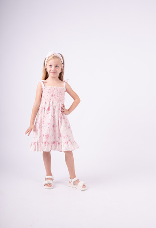 EBITA dress in pink color with floral design.