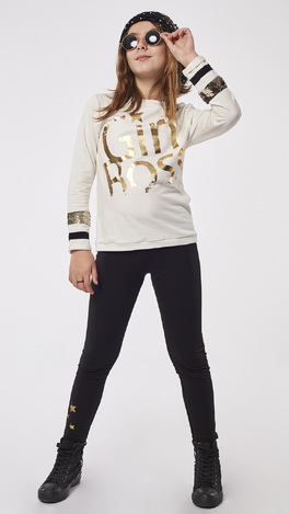 EBITA leggings set, off-white blouse and leggings with metallic star print on the bottom.