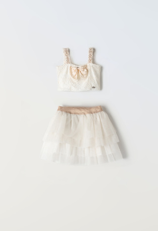 EBITA skirt set in off-white color with lace details.