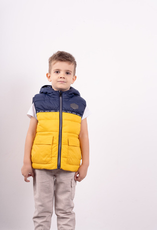 HASHTAG sleeveless jacket in yellow color with hood.