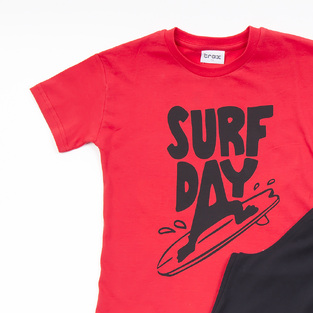 TRAX shorts set in red with "SURF DAY" logo.