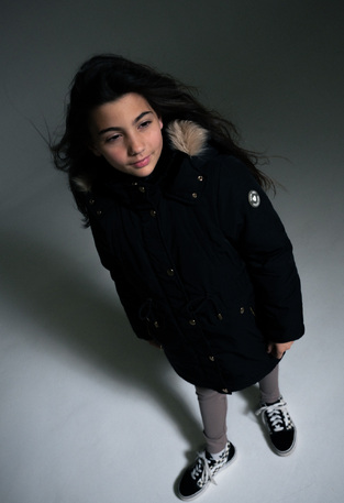 EBITA parka jacket in black color with hood.