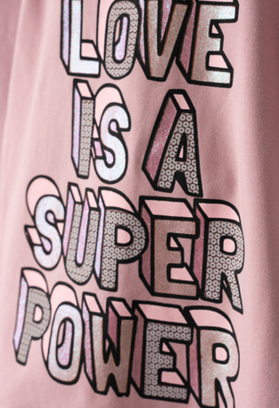 Seasonal set of EBITA leggings in pink with "LOVE IS A SUPER POWER" embossed logo.