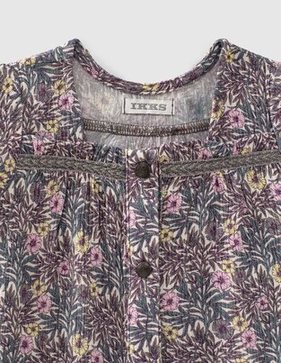 IKKS blouse with floral design and trunks.