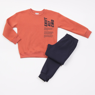 TRAX bodysuit set in orange color with embossed print.