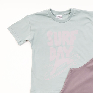 TRAX shorts set in mint color with "SURF DAY" logo.