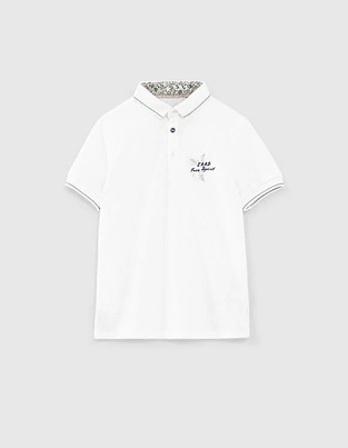 Ikks pique polo shirt in white color with embroidery.