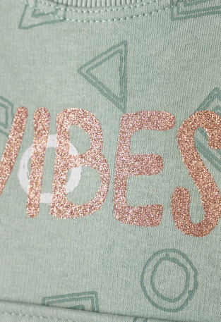 EBITA tracksuit set in verman color with embossed "VIBES" logo.